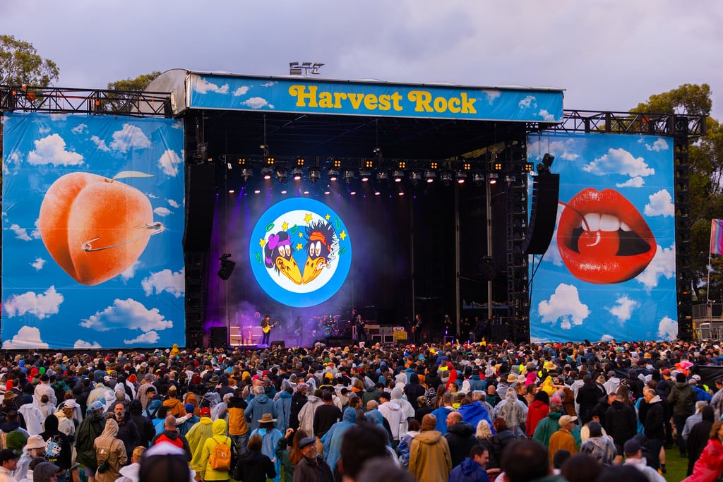 Harvest Rock stage from afar with crowds of people watching on