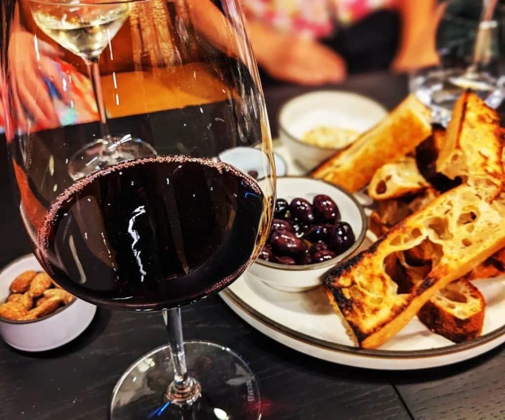 Glass of red wine and focaccia bread