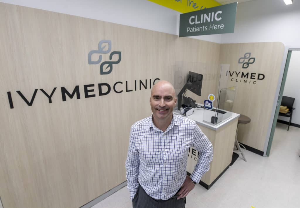 IvyMed CEO Aaron Langman standing in front of IvyMed clinic/logo