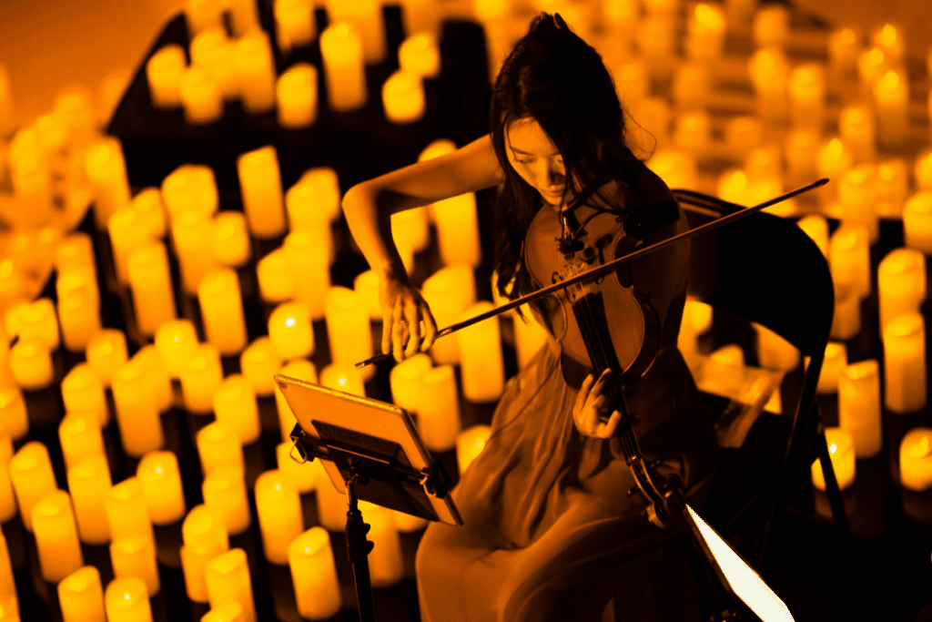 violinist playing at a Candlelight Concert