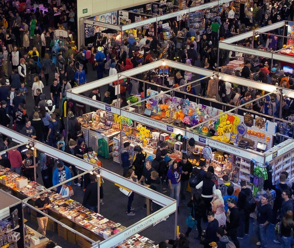 Bird-eye view of an indoor marketplace featuring anime and comic, video games