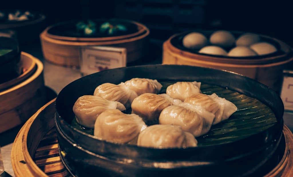 A platter of steamed and grilled dumplings at a Chinese restaurant.